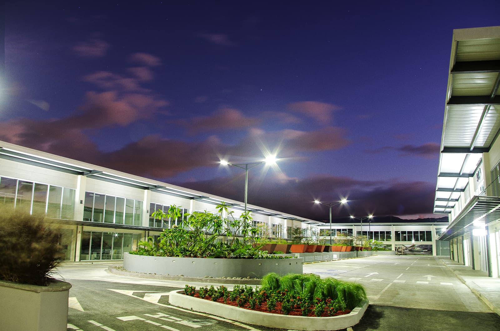 Plaza Aeropuerto façade lit up at night